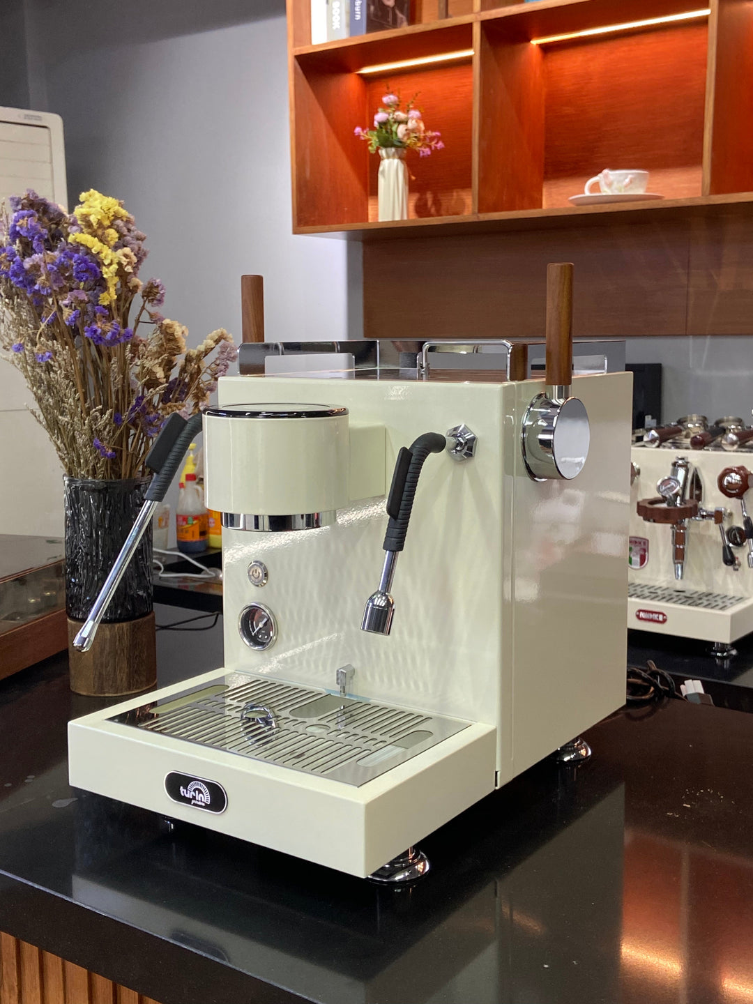 Turin MC3 espresso machine — light-finish machine, angled counter view